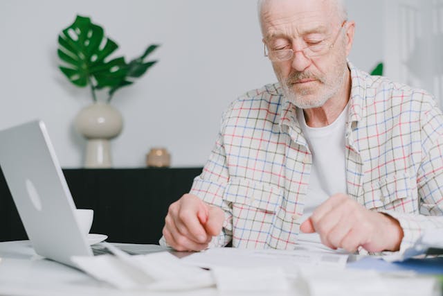 a%20person%20looking%20over%20financial%20documents